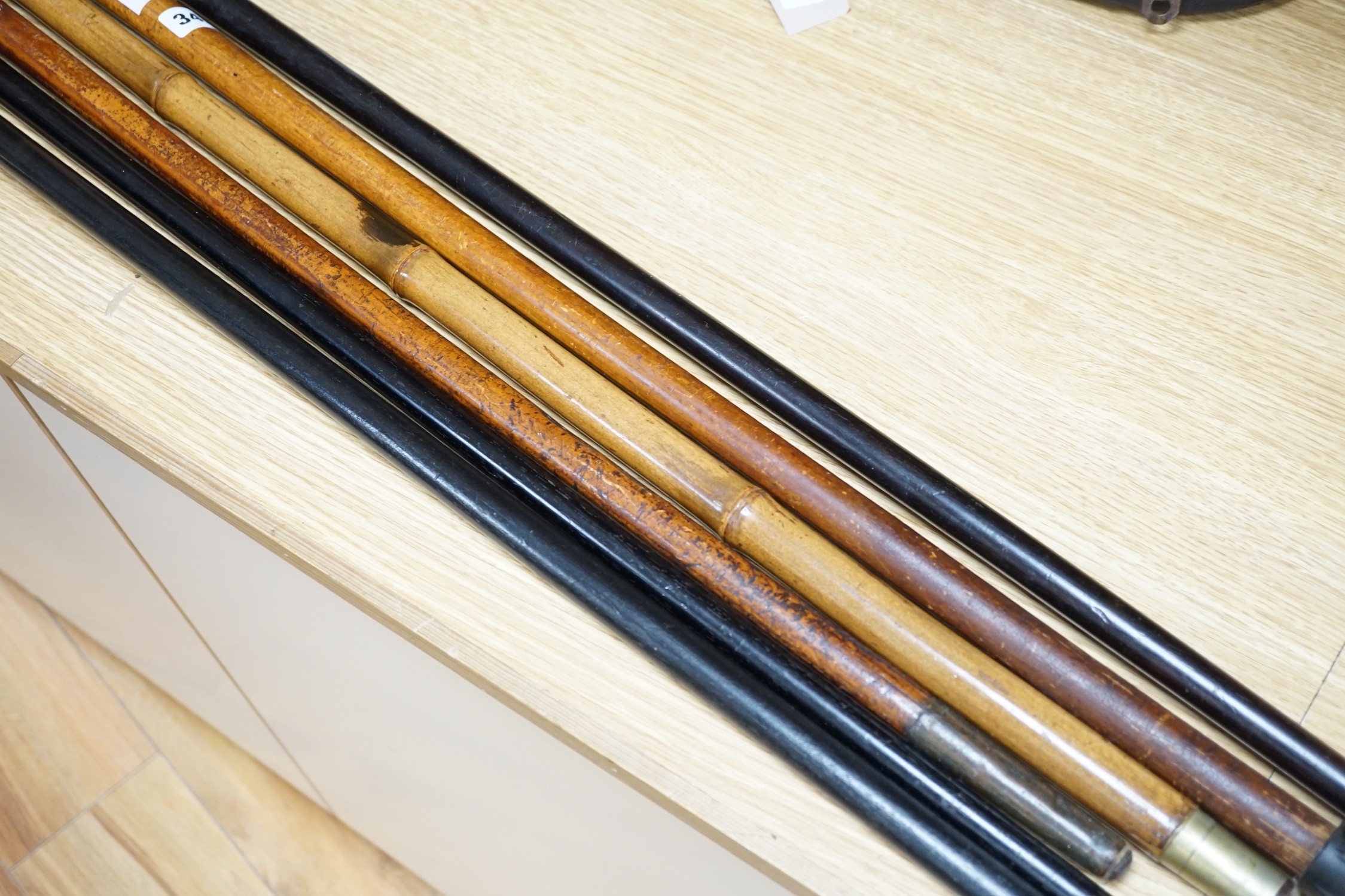 Two Victorian silver mounted walking sticks, a sword stick and three other sticks (6)